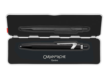 Black Caran D'Ache Roller Pen 849™ rollerball pen with sleek design on a white background.