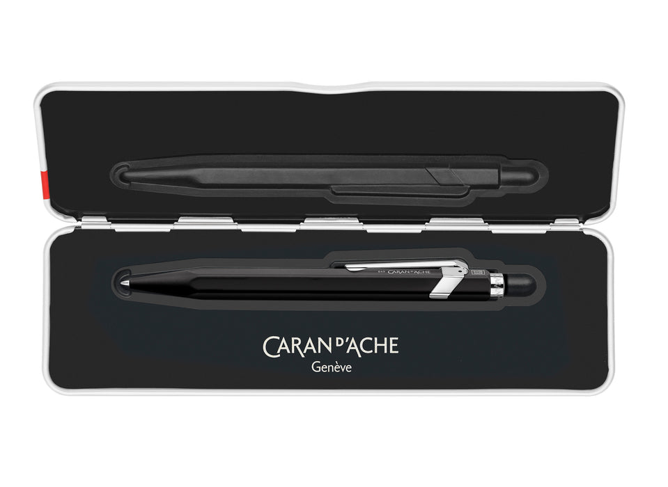 Black Caran D'Ache Roller Pen 849™ rollerball pen with sleek design on a white background.