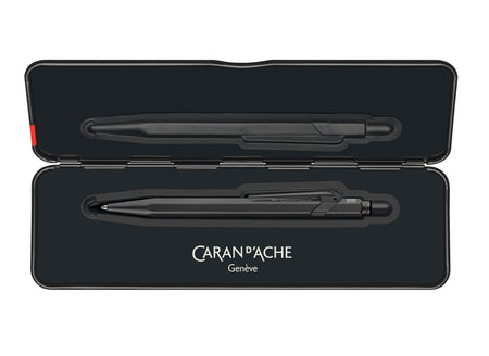 Caran D'Ache XL 849 black code ballpoint pen with sleek design and metal clip, displayed on slimpack packaging.