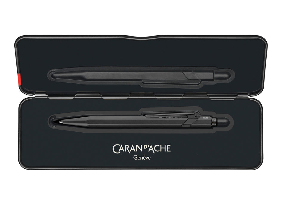 Caran D'Ache XL 849 black code ballpoint pen with sleek design and metal clip, displayed on slimpack packaging.