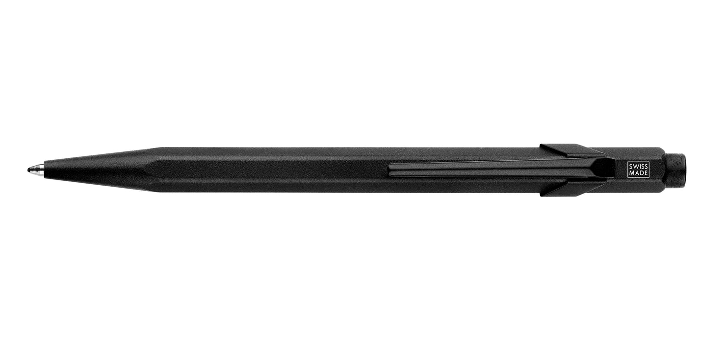 Caran D'Ache XL 849™ black ballpoint pen with sleek design and silver clip, shown from a front angle.