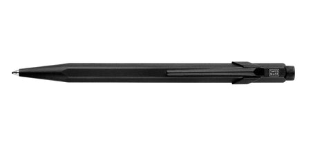 Caran D'Ache XL 849™ black ballpoint pen with sleek design and silver clip, shown from a front angle.