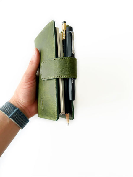 A6 leather journal cover in jungle green by Eng Leather Co., showcasing smooth leather and secure closure.