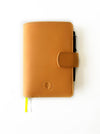 Aged natural leather journal cover by Eng Leather Co. for A6 size notebooks, featuring a rustic, handcrafted appearance.