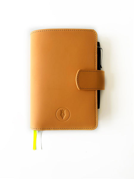 Aged natural leather journal cover by Eng Leather Co. for A6 size notebooks, featuring a rustic, handcrafted appearance.