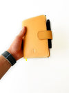 Aged natural leather A6 journal cover by Eng Leather Co. with visible stitching and smooth texture for a stylish notebook protection.