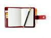 A6 leather journal cover in flat burgundy by Eng Leather Co., showcasing smooth leather with stitched edges.
