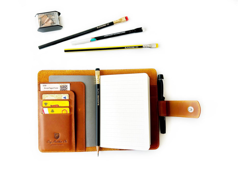 A6 leather journal cover in Crazy Horse brown by Eng Leather Co., featuring a textured leather exterior and secure closure.