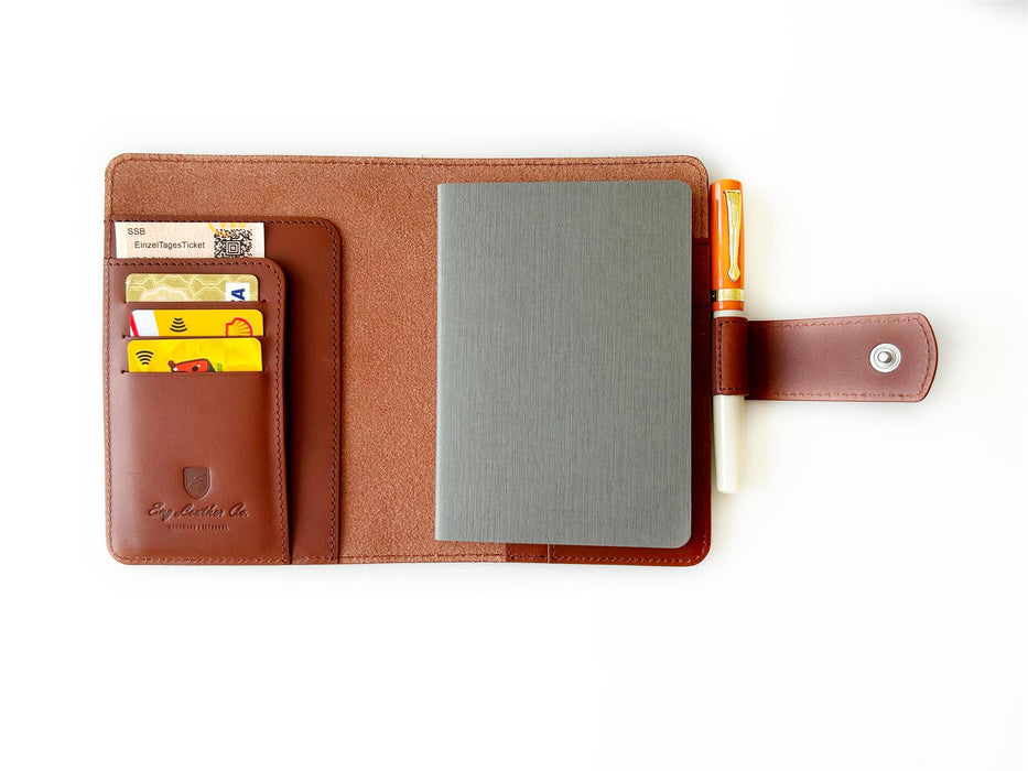A6 leather journal cover in English tan from Eng Leather Co., showcasing smooth leather with stitched edges and a sleek design.