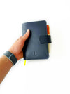A6 leather journal cover in navy blue by Eng Leather Co., featuring a sleek, smooth leather exterior and snug fit for A6 notebooks.