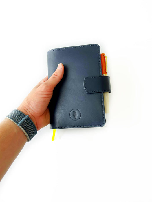 A6 leather journal cover in navy blue by Eng Leather Co., featuring a sleek, smooth leather exterior and snug fit for A6 notebooks.