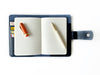 Navy blue leather journal cover by Eng Leather Co. for A6 size, shown flat with stitched edges and smooth finish.