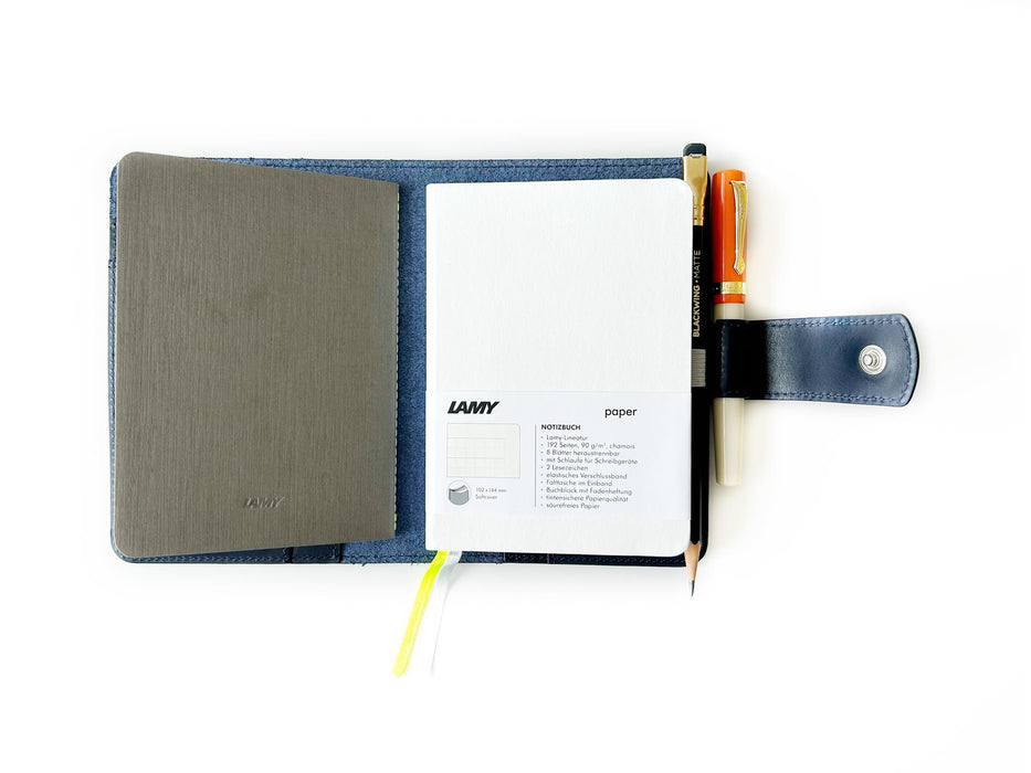 A6 leather journal cover in navy blue by Eng Leather Co., featuring a smooth leather exterior and secure closure.