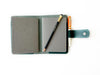 A6 leather journal cover in Northern Green by Eng Leather Co., featuring a sleek, textured leather design with a secure closure.