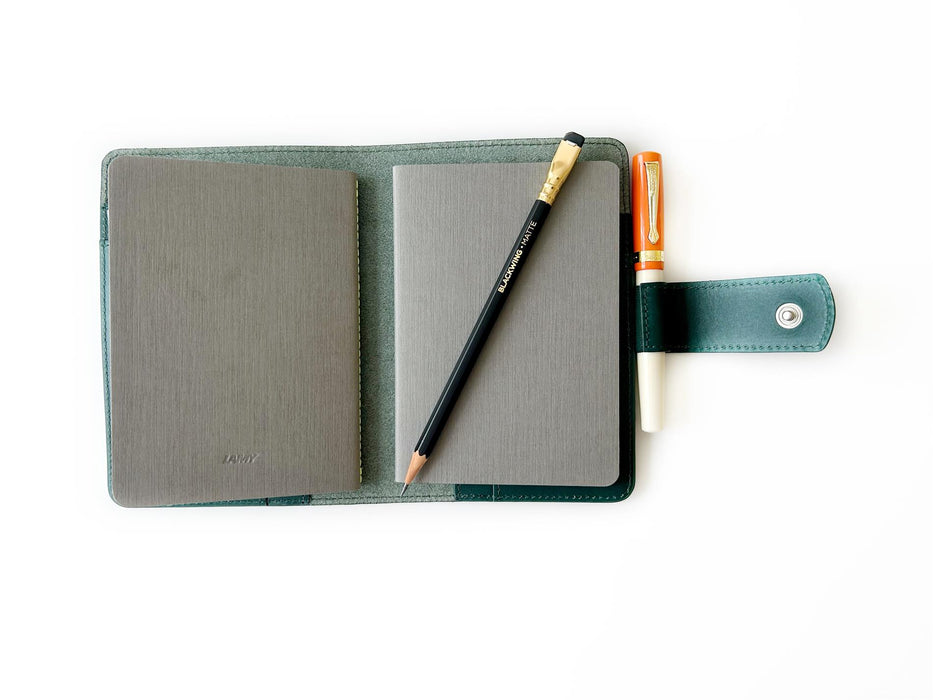 A6 leather journal cover in Northern Green by Eng Leather Co., featuring a sleek, textured leather design with a secure closure.