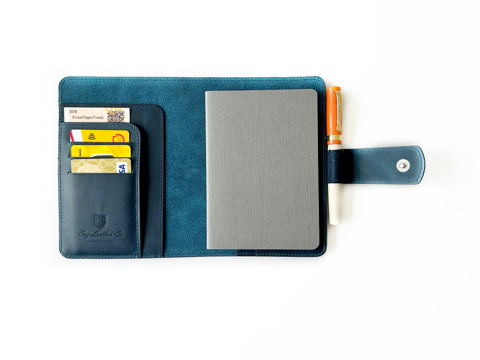 A6 size leather journal cover in ocean blue by Eng Leather Co., featuring textured leather and a sleek design.