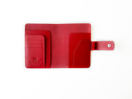 Eng Leather Co. A6 leather journal cover in vibrant ruby red with smooth texture and secure closure.