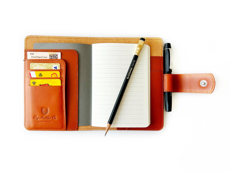 A6 leather journal cover in Sunrise Orange from Eng Leather Co., featuring a snug fit for a stylish and durable notebook.