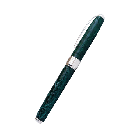 Green Grifos Cocodrie fountain pen with alligator leather detailing and a smooth ink nib, designed for elegant writing.