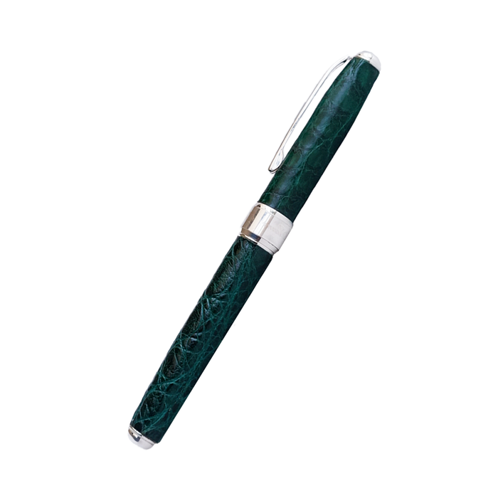 Green Grifos Cocodrie fountain pen with alligator leather detailing and a smooth ink nib, designed for elegant writing.
