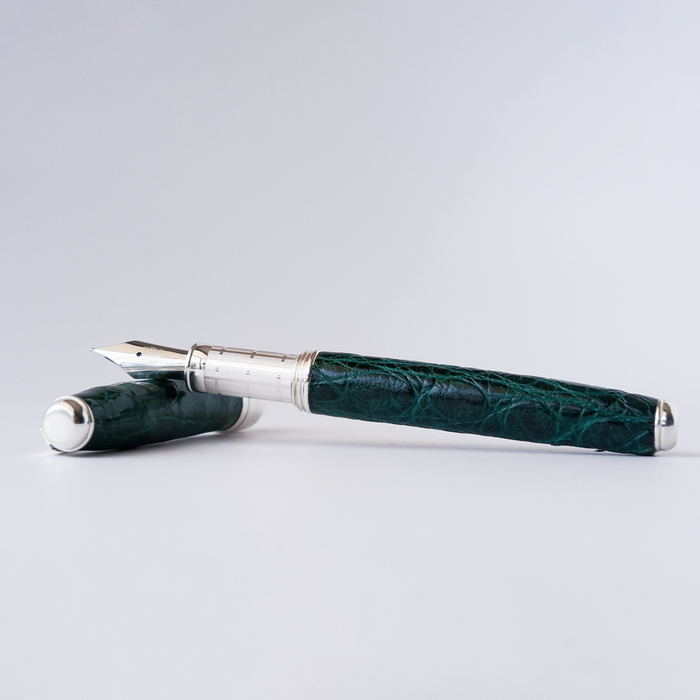 Green Grifos Cocodrie fountain pen with alligator leather finish featuring a crocodile design and gold accents.