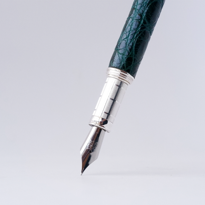 Green Grifos Cocodrie fountain pen with alligator leather grip for smooth writing and elegant design.