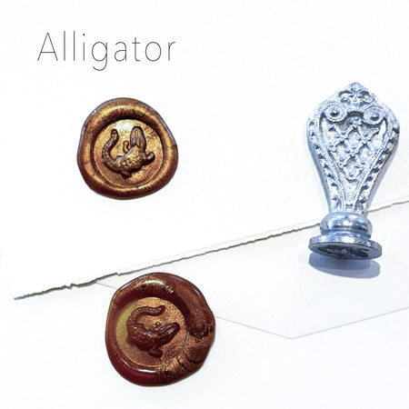 Le Potier D'etain wax seal featuring an alligator design, showcasing detailed craftsmanship on a round wax seal.