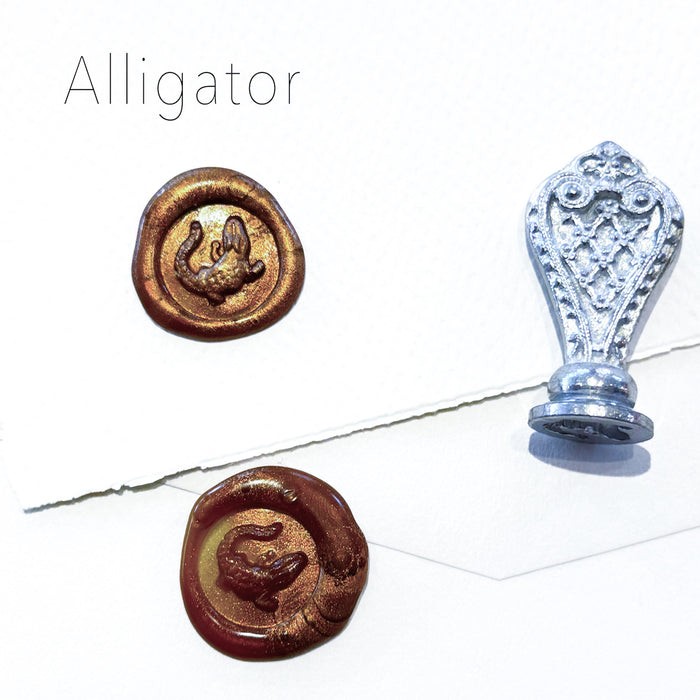 Le Potier D'etain wax seal featuring an alligator design, showcasing detailed craftsmanship on a round wax seal.