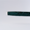 Green Grifos Cocodrie fountain pen with alligator leather texture, featuring a sleek design and elegant cap.