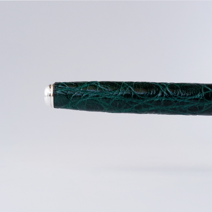 Green Grifos Cocodrie fountain pen with alligator leather texture, featuring a sleek design and elegant cap.