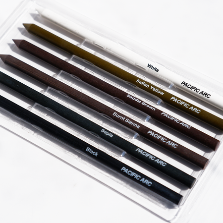 Pacific Arc Art Colors 5.6mm art lead pencil, shown in a close-up with colorful lead and brand logo.