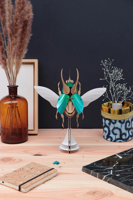 Large Paper Atlas Beetle craft by Assembli, showcasing detailed paper model with vibrant colors and intricate design.