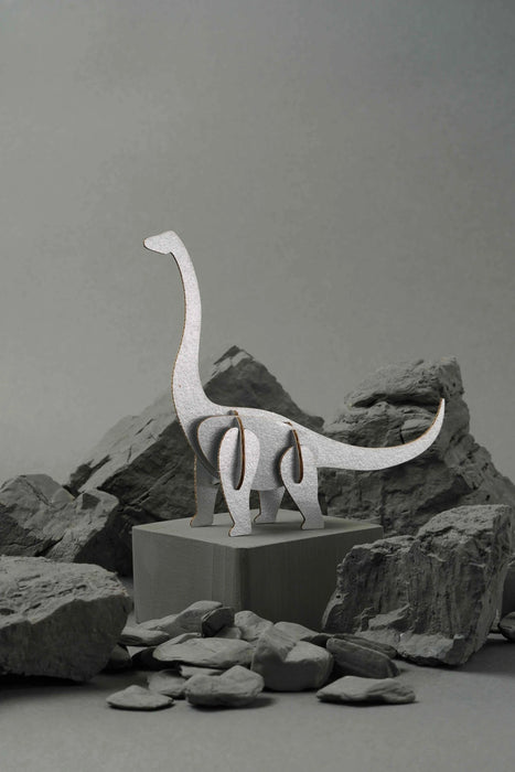 Silver-scaled paper Brachiosaurus craft by Assembli, showcasing a detailed dinosaur model made from paper materials.