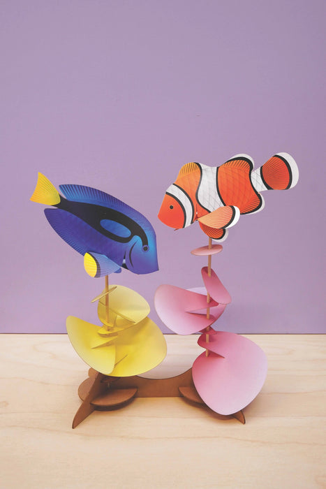 Colorful Assembli fish craft set featuring a clownfish and blue tang, perfect for creative kids' art projects.