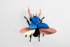 Assembli Paper Giant Stag Beetle in blue, detailed craft model with textured wings and antenna, assembled for display.