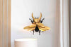 Gold-colored Paper Giant Stag Beetle by Assembli displayed on a neutral background.