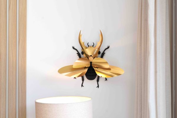Gold-colored Paper Giant Stag Beetle by Assembli displayed on a neutral background.