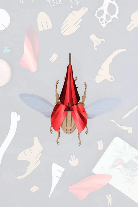 Assembli Paper Hercules Beetle craft, large detailed insect model with textured wings and prominent horns, suitable for educational projects.