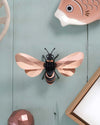 Assembli Paper Honey Bee craft in rose gold, top-down view showcasing intricate paper details and craft design.