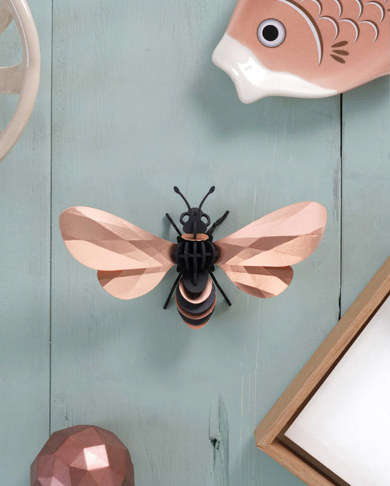 Assembli Paper Honey Bee craft in rose gold, top-down view showcasing intricate paper details and craft design.