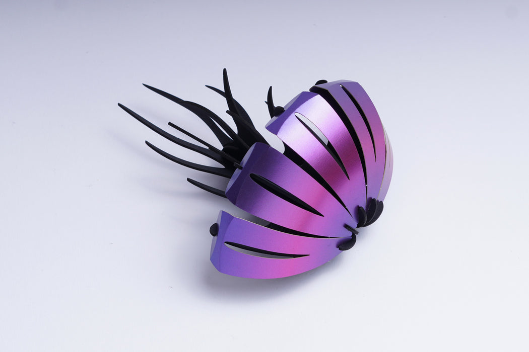 Purple paper jellyfish craft by Assembli, showcasing a delicate, handcrafted paper jellyfish with flowing tentacles.