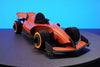 Assembli paper race car craft in flaming orange with front view, showcasing detailed design and vibrant colors.