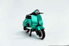 Green vintage paper scooter craft by Assembli, featuring detailed paper model with front view.