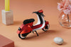 Red vintage paper scooter craft by Assembli, featuring detailed miniature design for creative DIY projects.