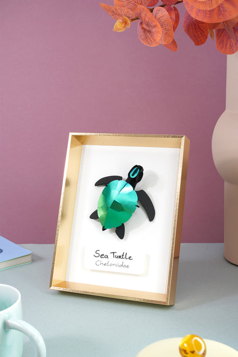 Crafts paper sea turtle baby by Assembli, featuring detailed blue and green sea turtle design for children's arts and crafts.