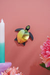 Craft paper sea turtle baby made by Assembli, featuring colorful paper layers and detailed shell design for arts and crafts projects.