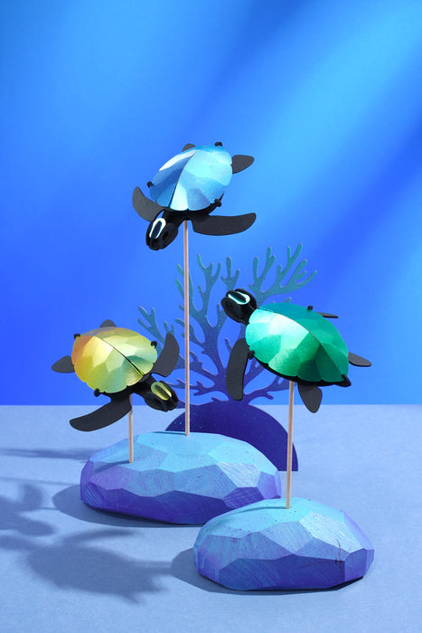 Assembli Paper Sea Turtle baby craft set with three colorful paper sea turtle figures for creative crafting and decoration.