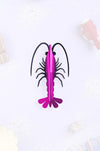 Pink paper shrimp craft by Assembli, showcasing a detailed, folded paper shrimp made for creative arts projects