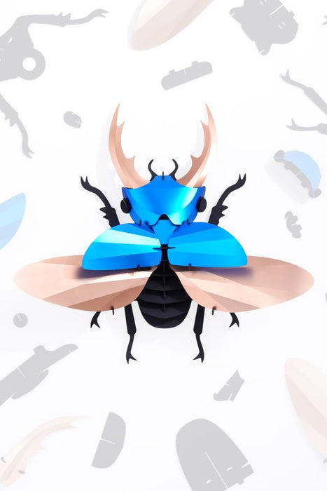 Blue Paper Giant Stag Beetle by Assembli, detailed paper craft model with intricate features and realistic stag beetle appearance.