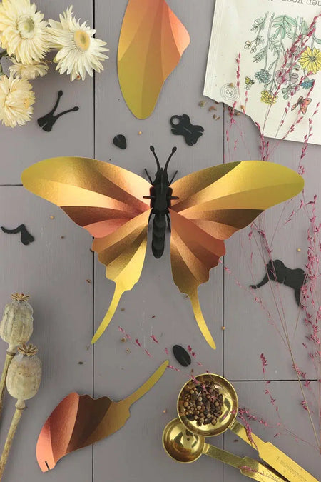 Yellow Paper Swordtail Butterfly craft by Assembli, showcasing detailed paper wings and handcrafted design.